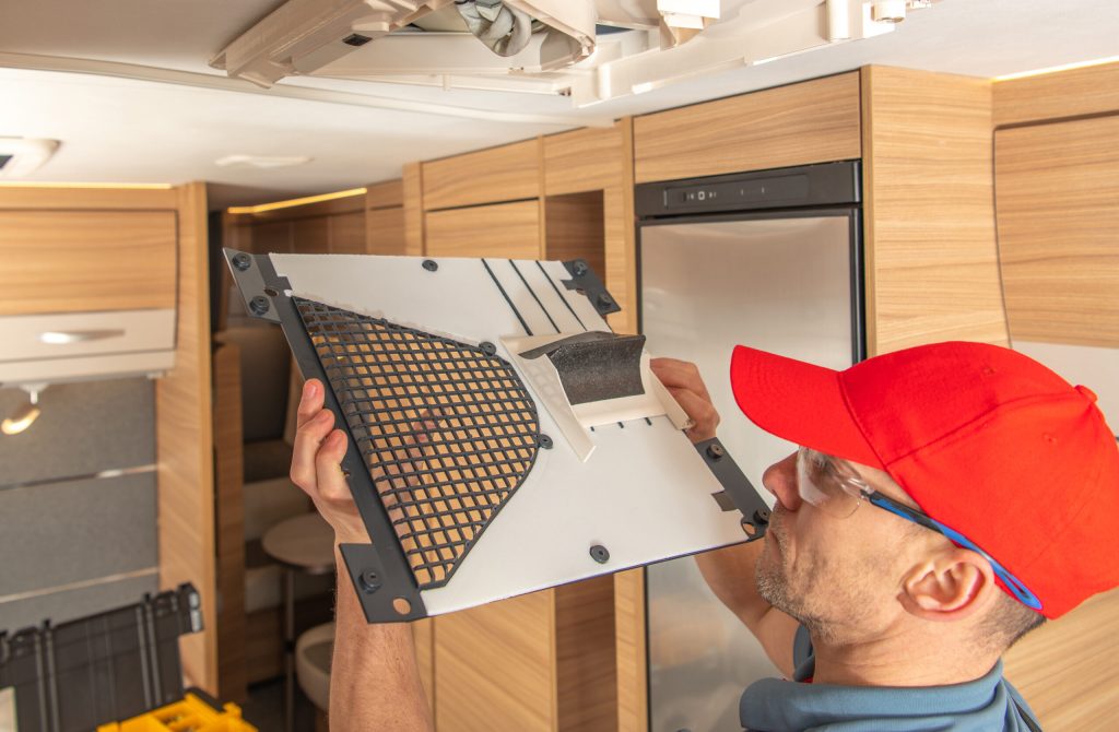 RV Camper Van Air Condition Unit Maintenance Performed by Professional RV Appliances Specialist.